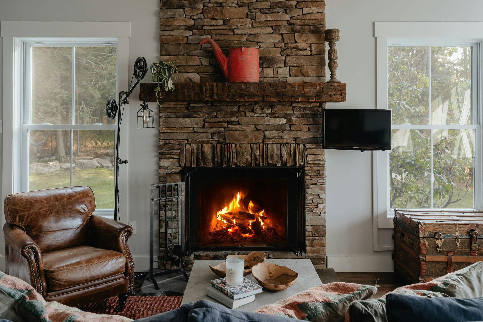 a living room filled with furniture and a fire place